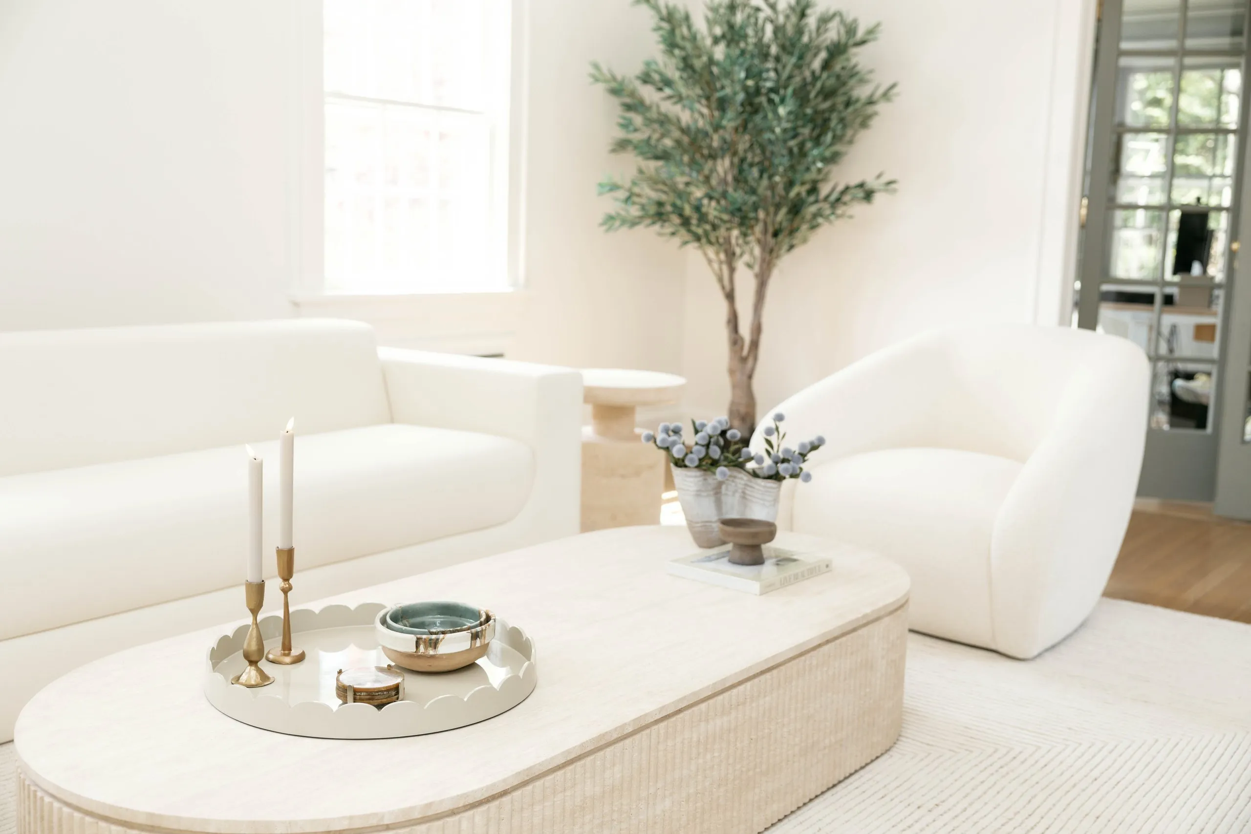 Bright Short Hills living room with sculptural white seating